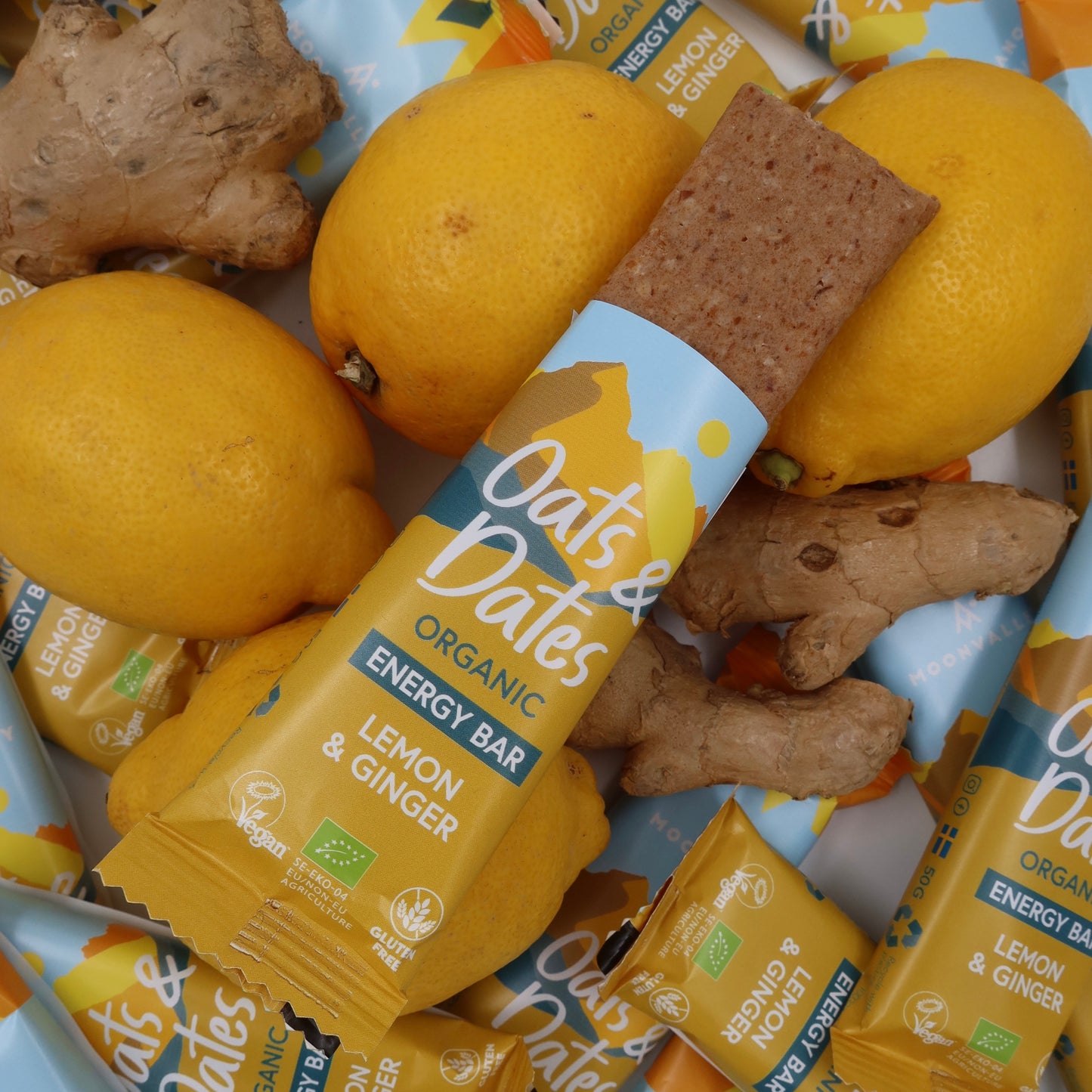 Moonvalley Organic Energy Bars Oats & Dates Lemon & Ginger open package with lemons and giner