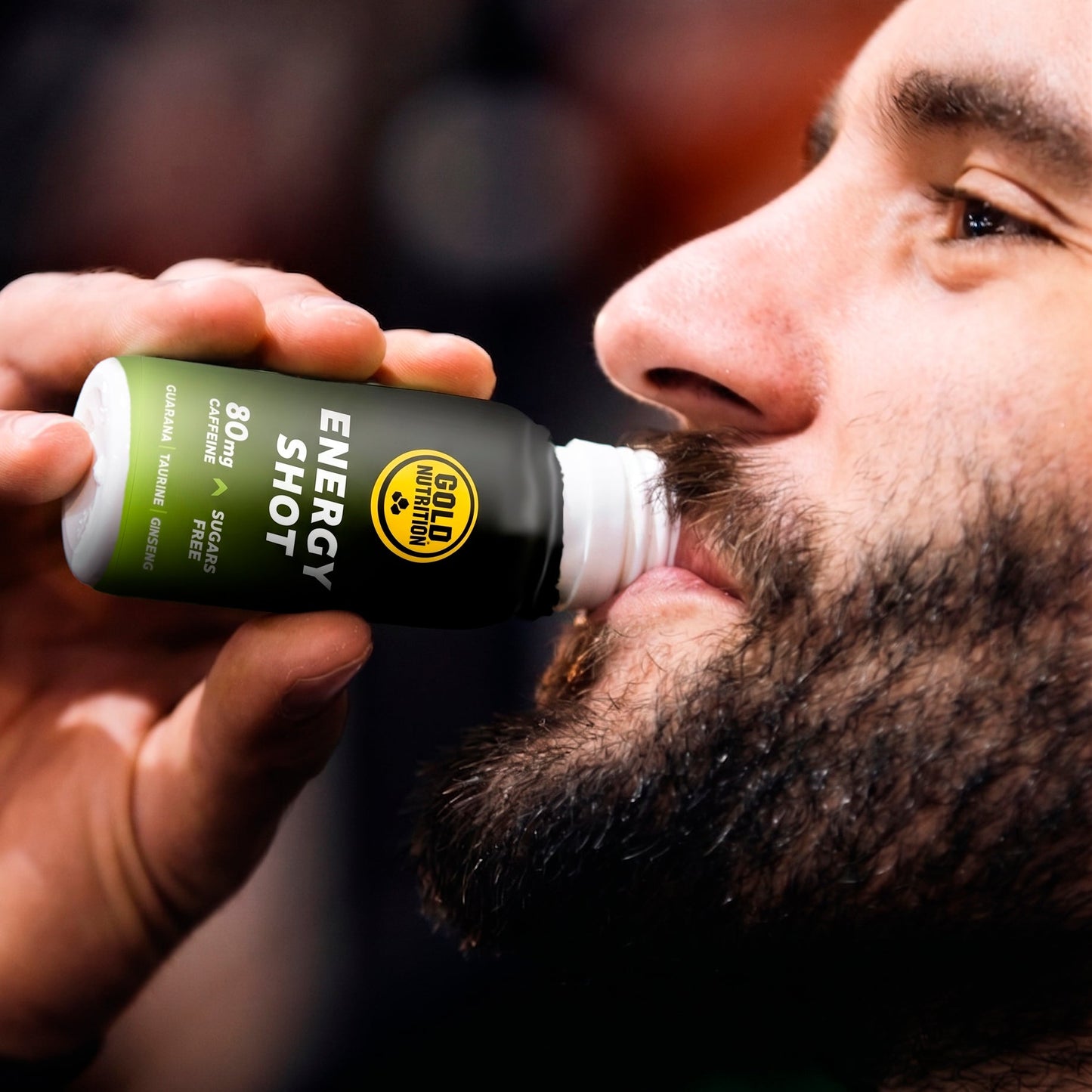 Goldnutrition One Shot Energy - Tropical Fruits man drinking shot