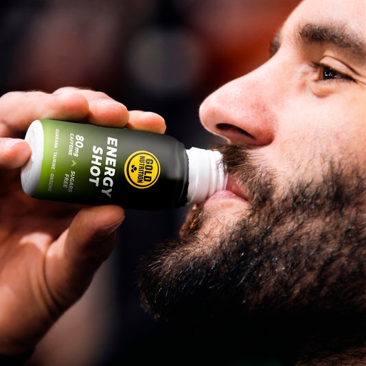 Goldnutrition One Shot Energy - Tropical Fruits man drinking shot