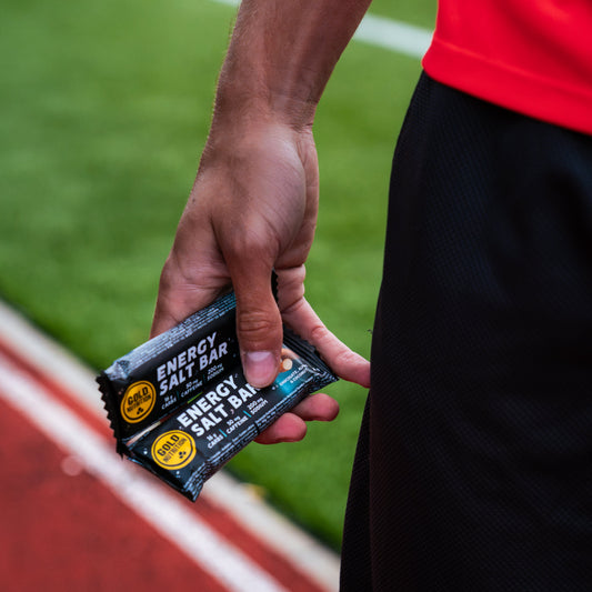 GoldNutrition sports man holding GoldNutrition Energy Salt Bar - Chocolate